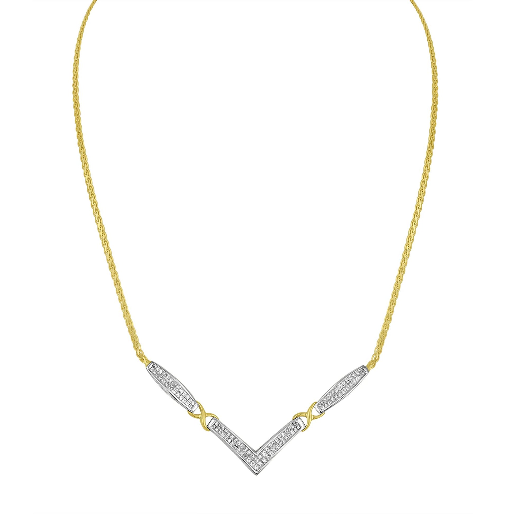 Front-facing image of a necklace with a yellow chain and white metal sections set with multiple white princess-shaped gemstones in an invisible setting, forming a chevron design.
