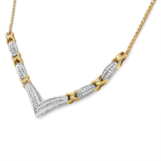 Close-up front angle of a two-tone necklace featuring alternating yellow and white sections with round white gemstones in a channel setting.