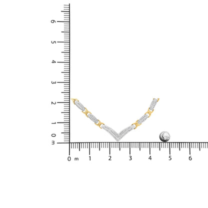 Necklace with alternating yellow and white metal links, white gemstones in channel setting on white metal sections, displayed flat on a ruler for size reference, front angle.