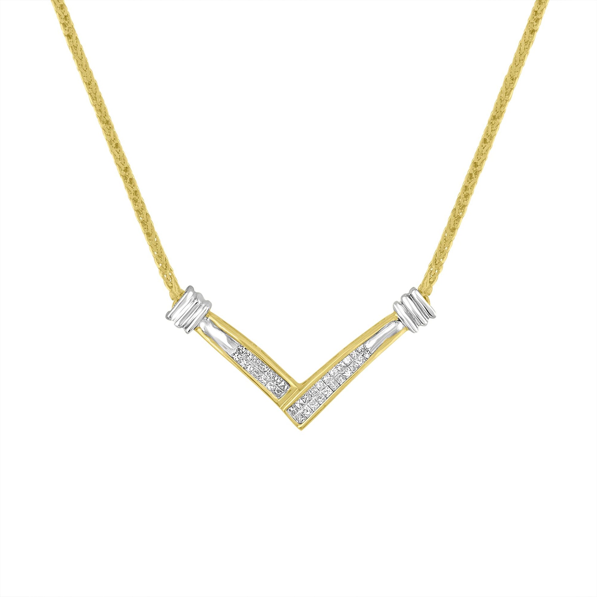 Front-facing shot of a V-shaped yellow and white metal necklace with channel-set white princess-shaped gemstones in the center.