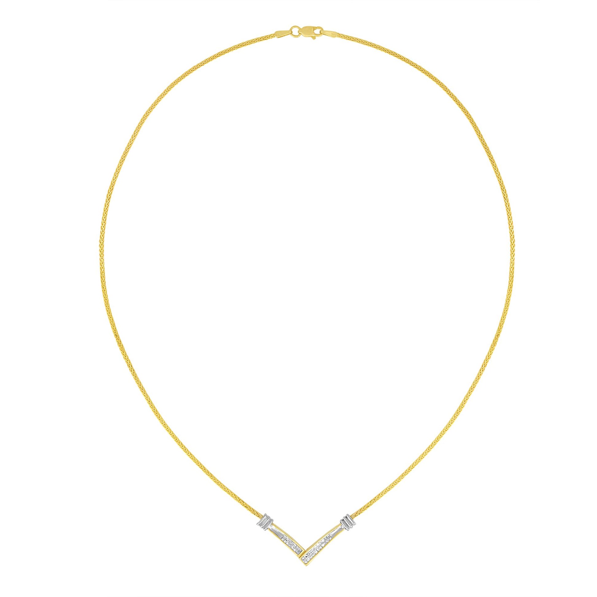 Front view of a necklace with a V-shaped pendant featuring channel-set white princess shape gemstones, on a yellow metal chain.
