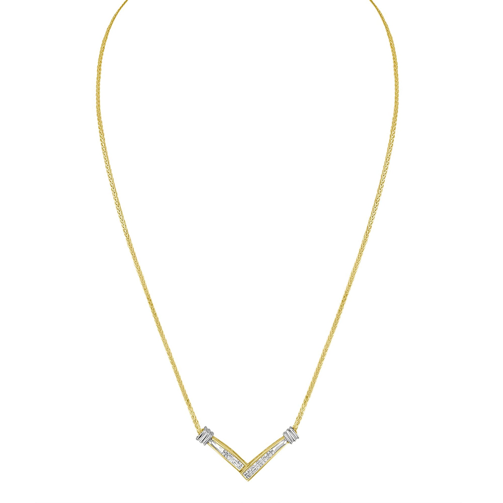 Front view of a V-shaped necklace with a yellow metal chain and white metal accents, featuring channel-set white princess-shaped gemstones.