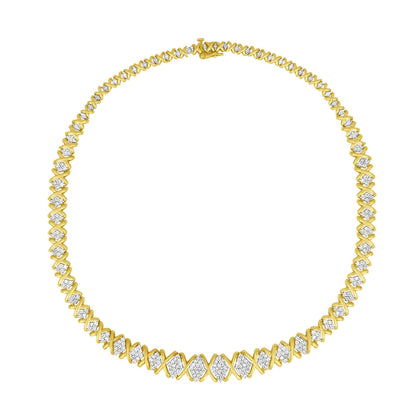 Front-facing shot of a yellow metal necklace with alternating sections of pave-set round white gemstones and smooth metal X-shaped links.