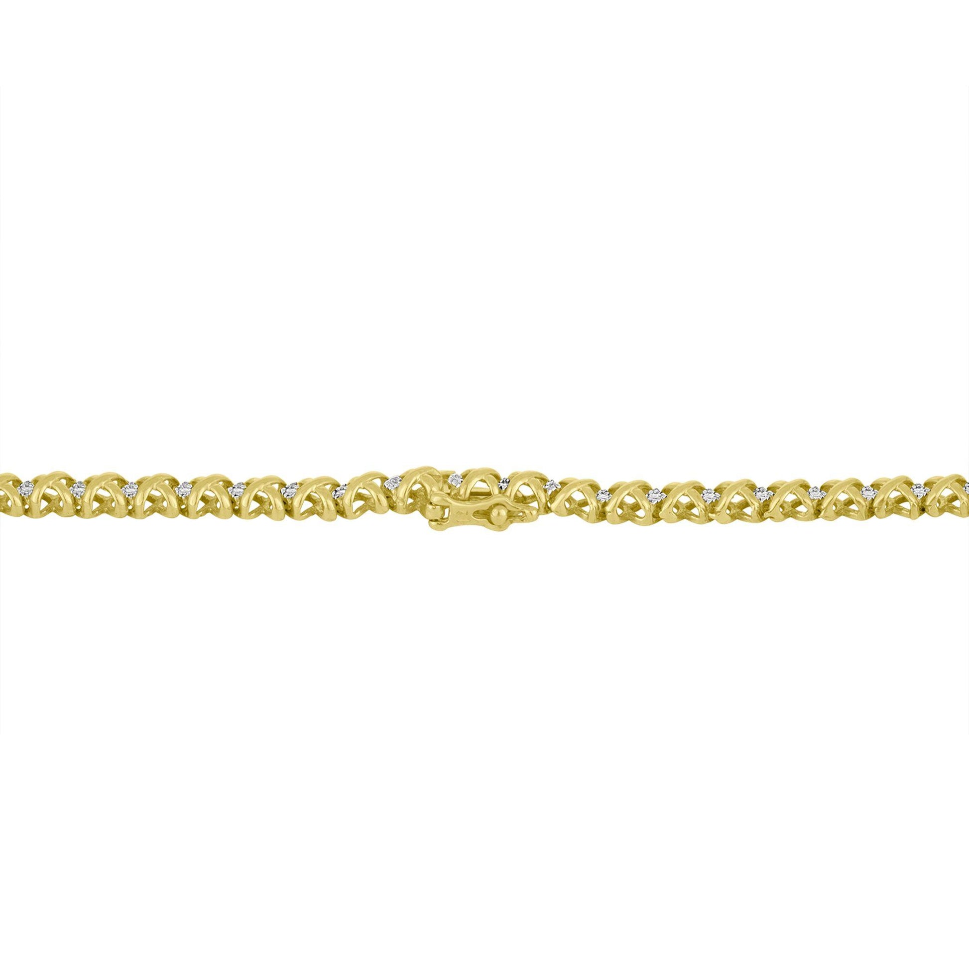 Close-up, flat lay of a yellow necklace with an intricate link design, featuring round white gemstones in a pave setting along the links.