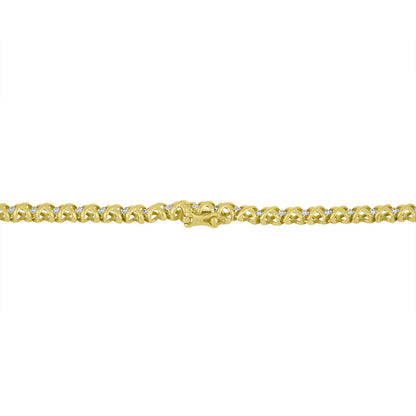 Close-up, flat lay of a yellow necklace with an intricate link design, featuring round white gemstones in a pave setting along the links.