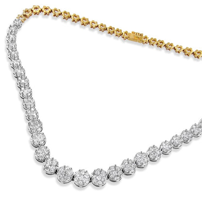 Close-up angled shot of a yellow necklace featuring round white gemstones in a pave setting along one side and floral-shaped yellow metal links on the other side.
