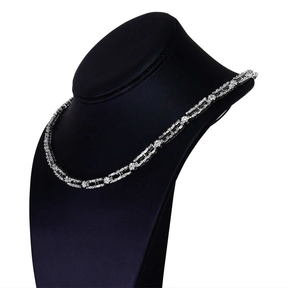 White metal necklace with alternating baguette and round white gemstones, displayed on a black necklace bust, shown from a slightly angled front view.