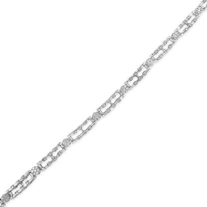 White metal necklace shown flat from a top-down angle, featuring alternating sections of baguette-shaped white gemstones in prong settings and round-shaped white gemstones in channel settings.