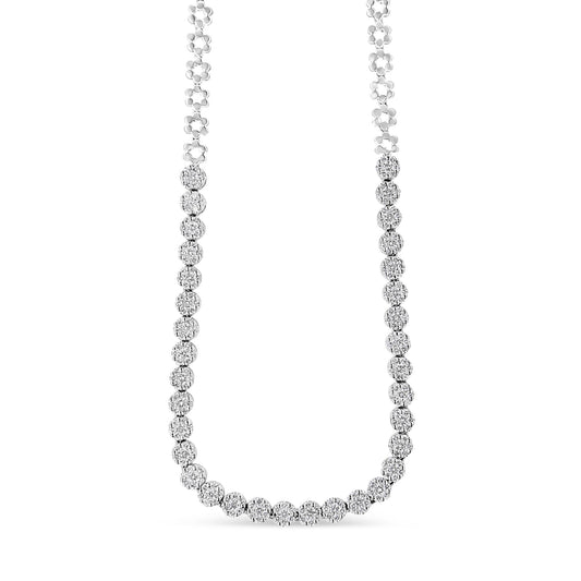 Front-facing view of a white metal necklace with round white gemstones in a pave setting along the lower half.