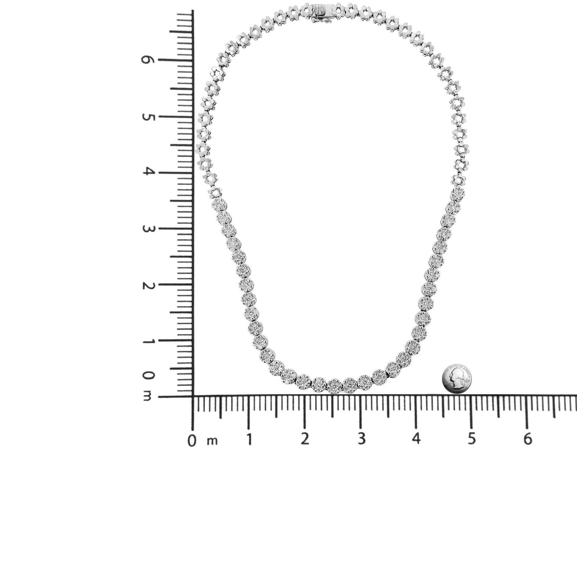 Top-down view of a white necklace with round white gemstones in pave setting, displayed on a ruler for size reference.
