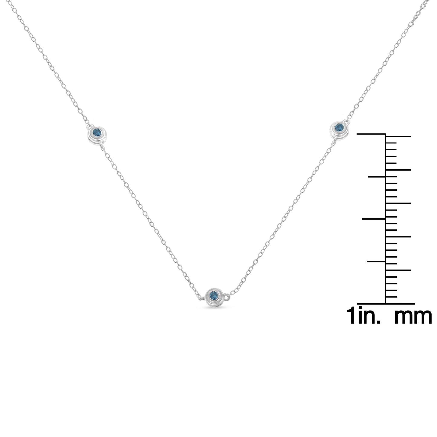 Close-up front angle of a white necklace with multiple round blue gemstones in bezel settings, shown with a ruler for size reference.