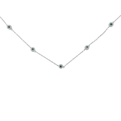 White metal necklace with round blue gemstones in bezel settings evenly spaced along a thin chain, shown from a front angle.