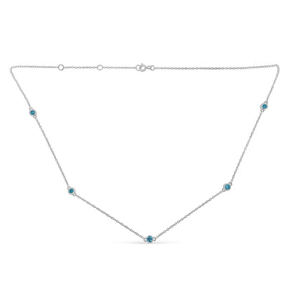 White necklace with round blue gemstones set in bezels along the chain, shown from a flat front angle.