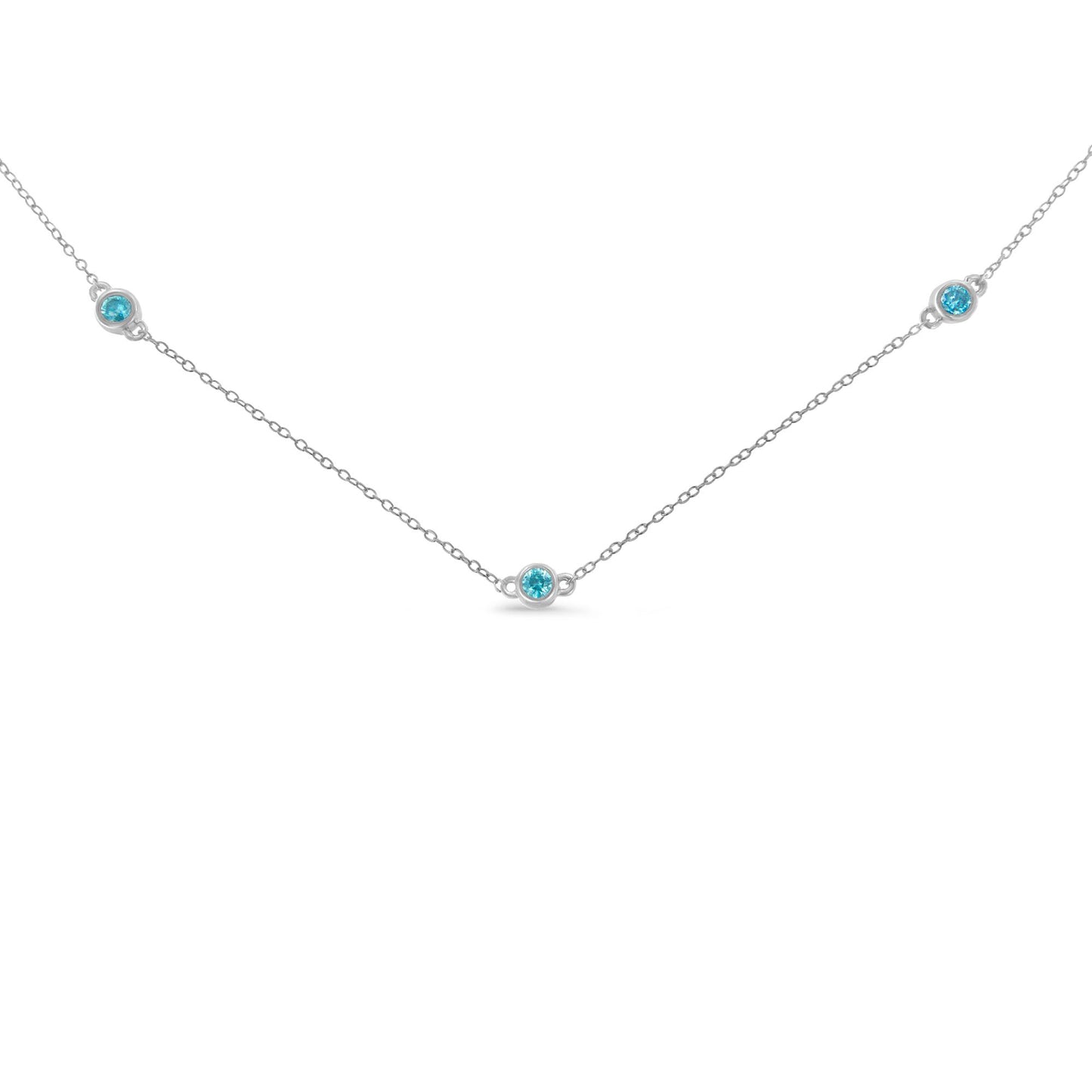 Front view of a white metal necklace with five round blue gemstones in bezel settings evenly spaced along the chain.