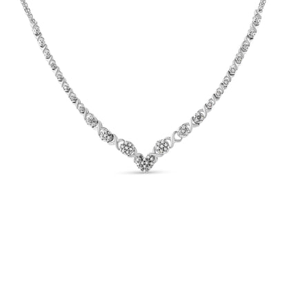 Front view of a white necklace with round pave set white gemstones forming a heart shape in the center and extending along the chain.