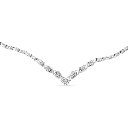 Close-up front angle of a white necklace with round-shaped white gemstones in a pave setting arranged in a V pattern.