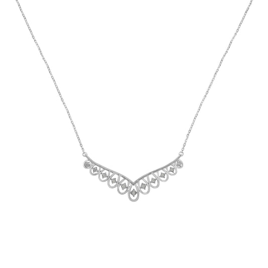 Front-facing view of a white metal necklace with a V-shaped pendant featuring multiple round white gemstones set in a miracle setting.
