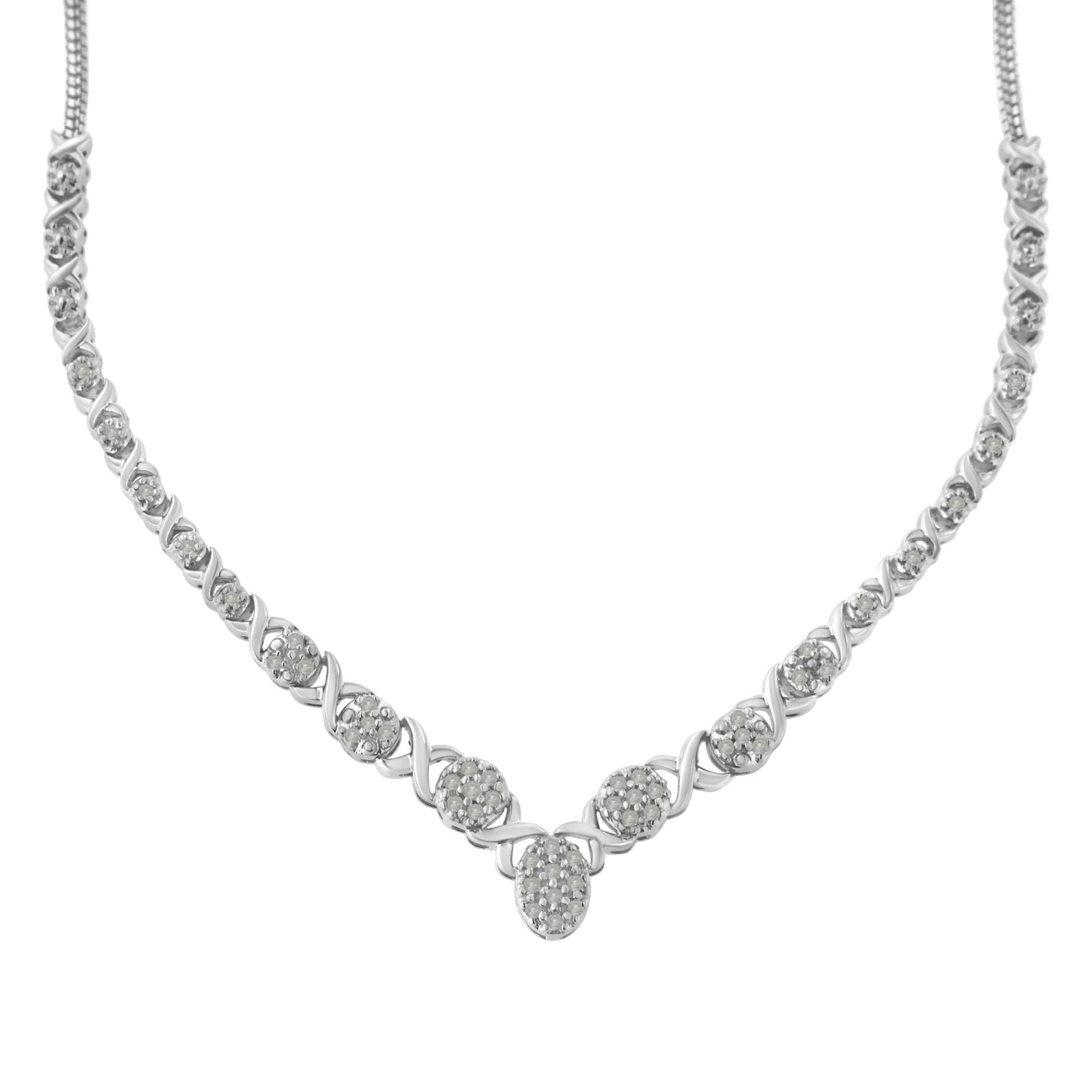 Front-facing view of a white metal necklace featuring round white gemstones in prong settings arranged in a pattern with curved links.