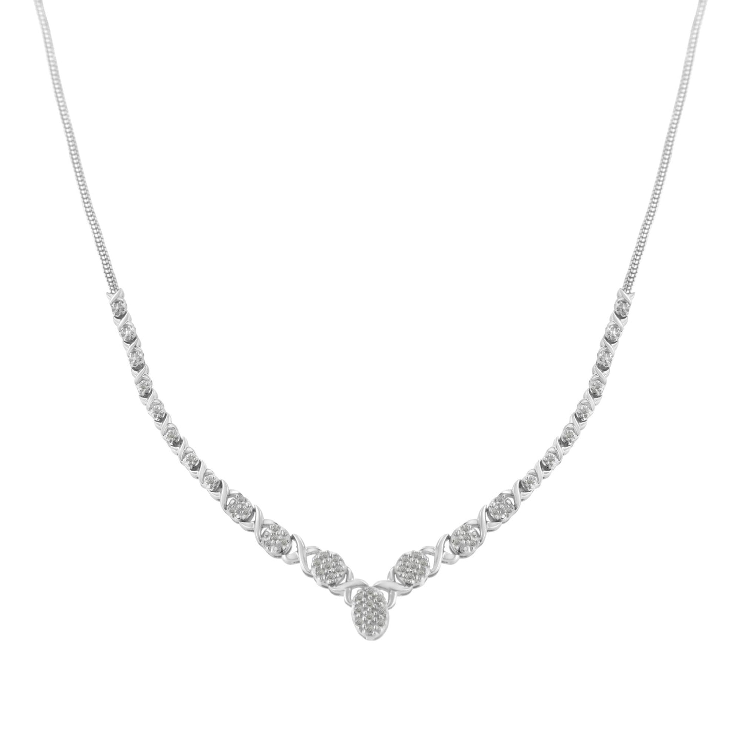 Front-facing shot of a white metal necklace with round white gemstones in prong settings arranged symmetrically along the chain, forming a gentle V shape at the center.