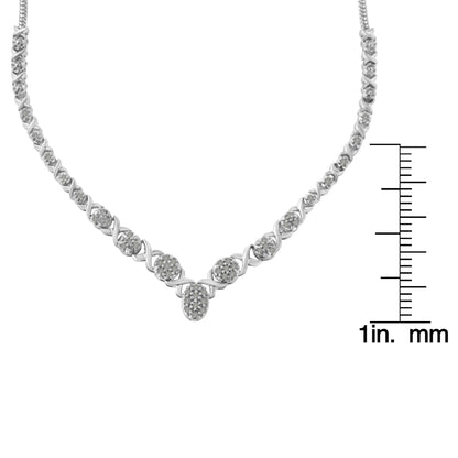 Close-up front view of a white metal necklace with round white gemstones in prong settings, displayed next to a ruler for size reference.