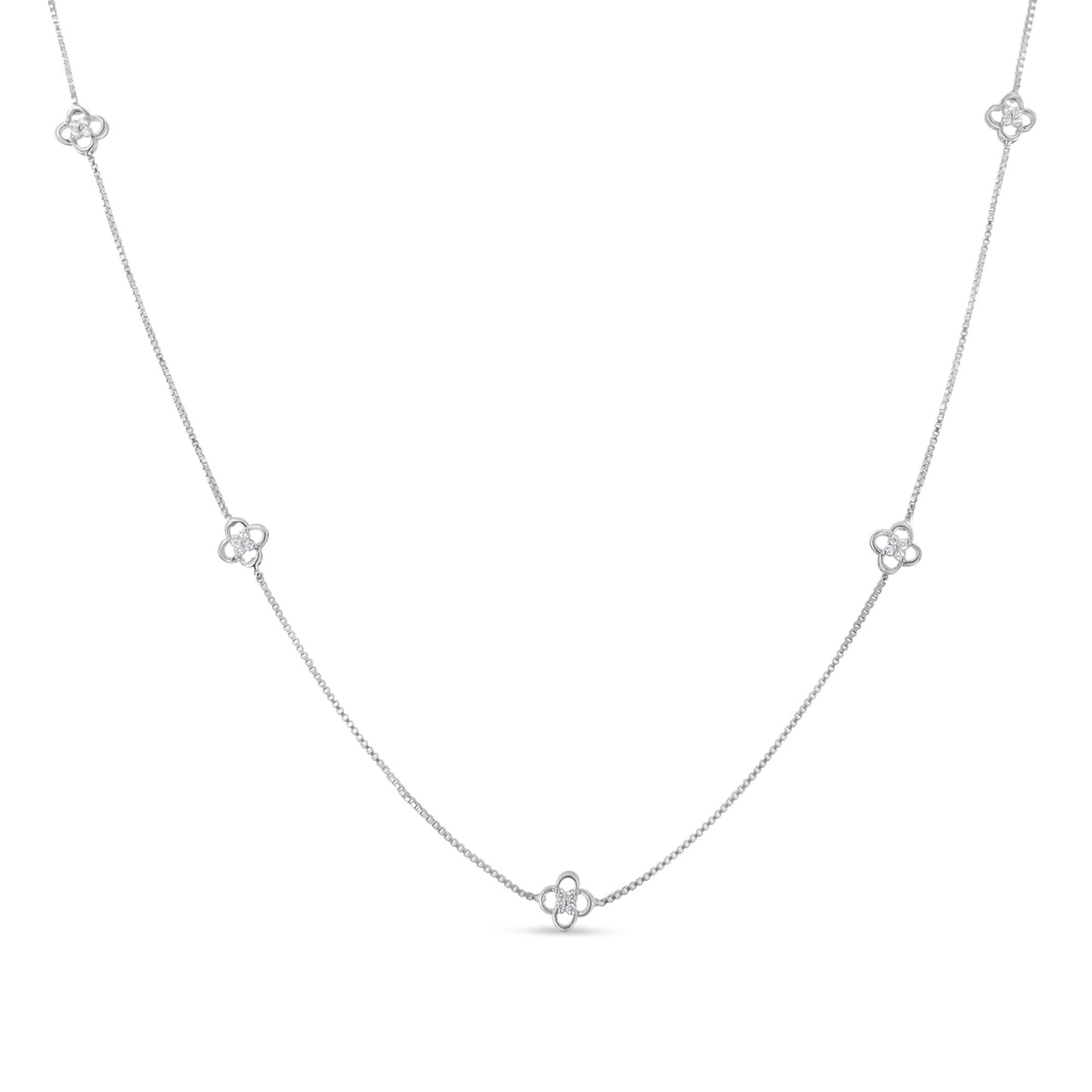 White metal necklace with small floral-shaped clusters of white gemstones evenly spaced along the chain, shown from a front-facing angle.