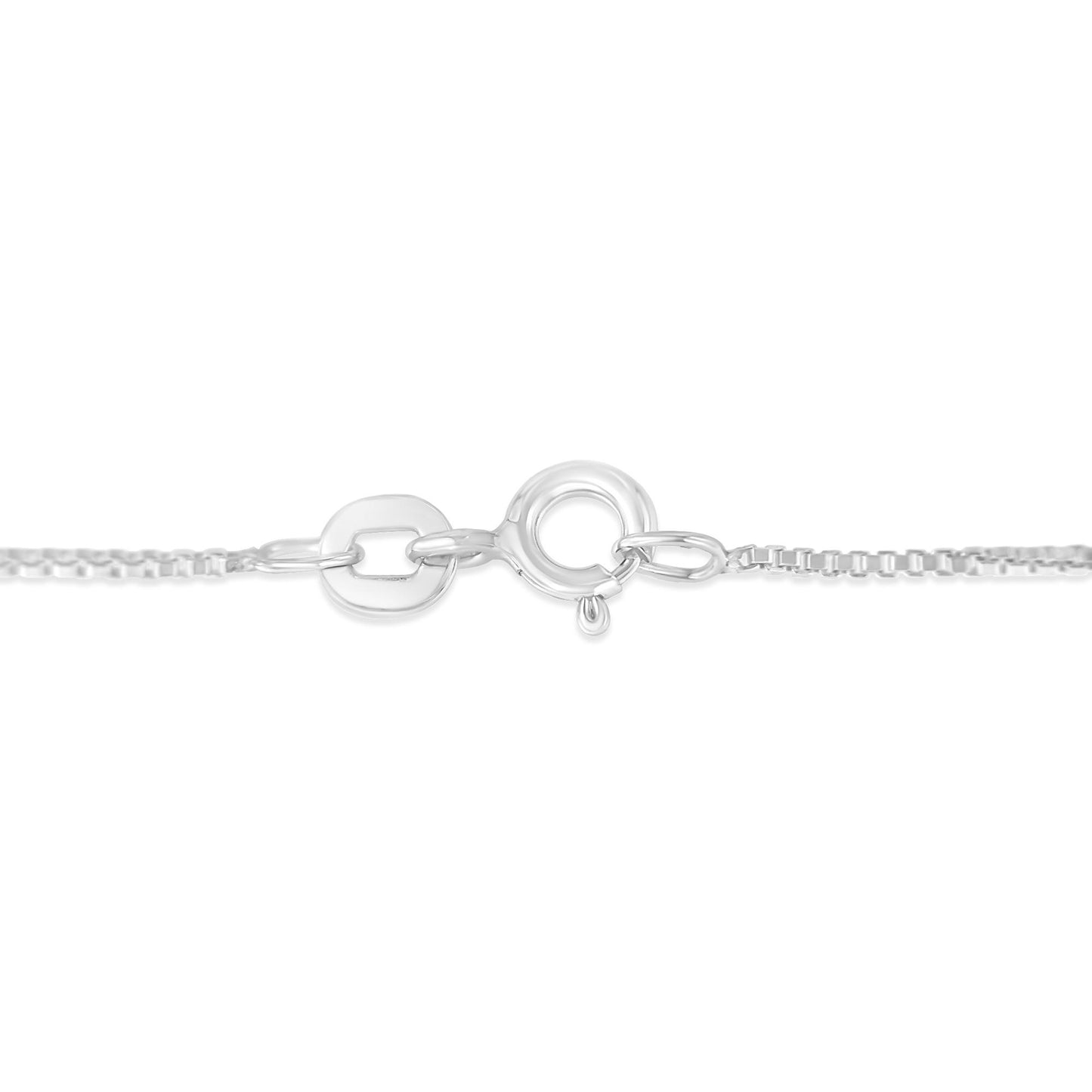 Close-up front view of white metal necklace clasp with chain links on either side.