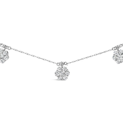 Close-up front view of a white metal necklace featuring multiple flower-shaped clusters of round white gemstones in prong settings spaced evenly along a delicate chain.