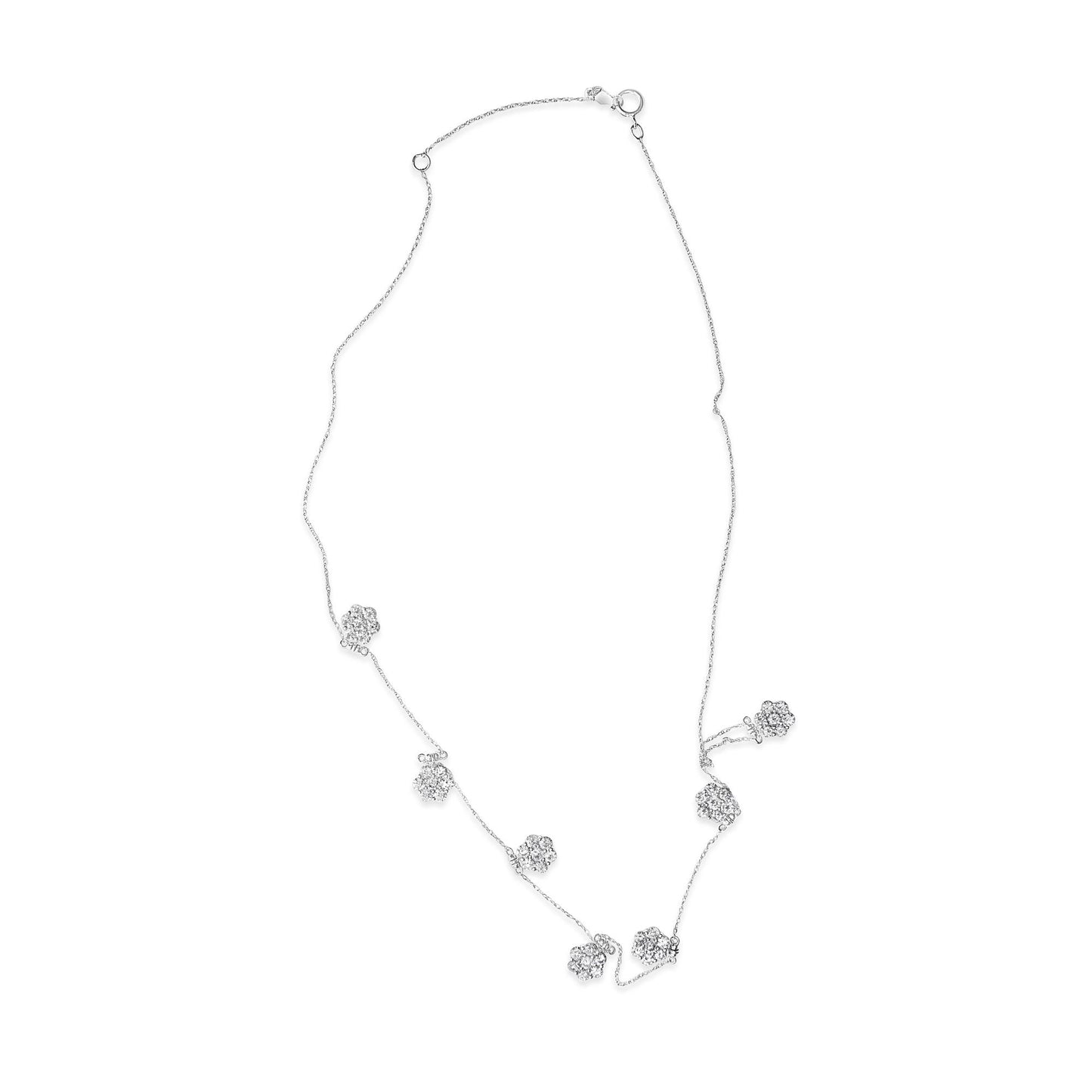 White metal necklace with multiple clusters of round white gemstones in prong settings, shown from a top-down angle.