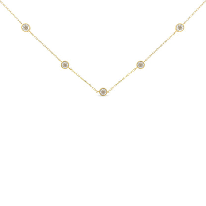 Yellow necklace with round brownish gemstones in miracle settings, shown flat from the front angle.