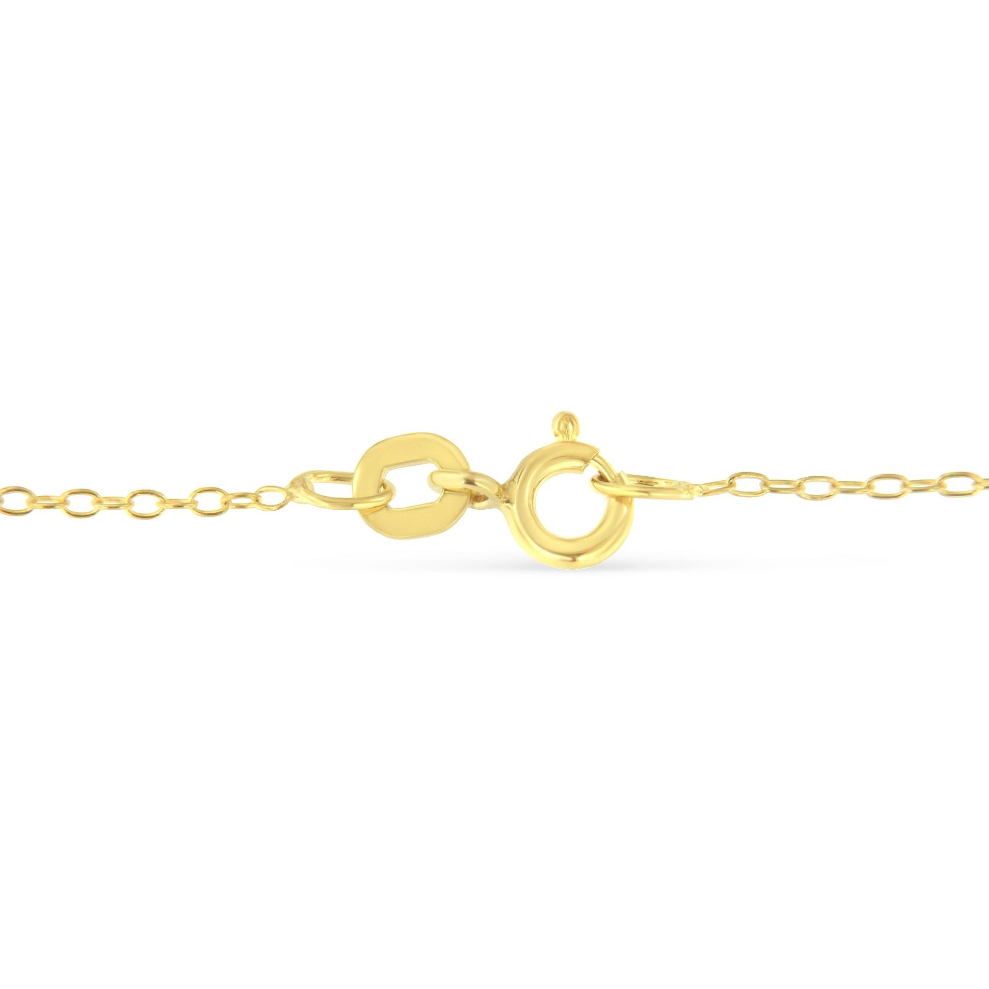 Close-up front view of yellow metal necklace clasp and chain links on white background.