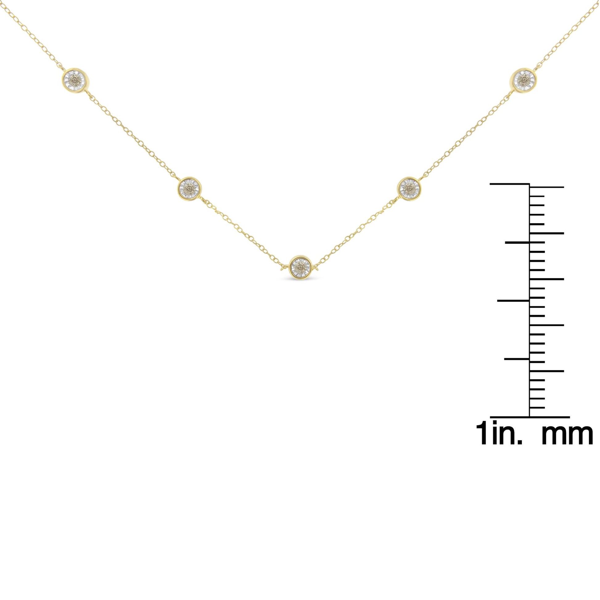 Yellow necklace with round brownish gemstones in miracle settings, photographed flat with a scale for size reference.