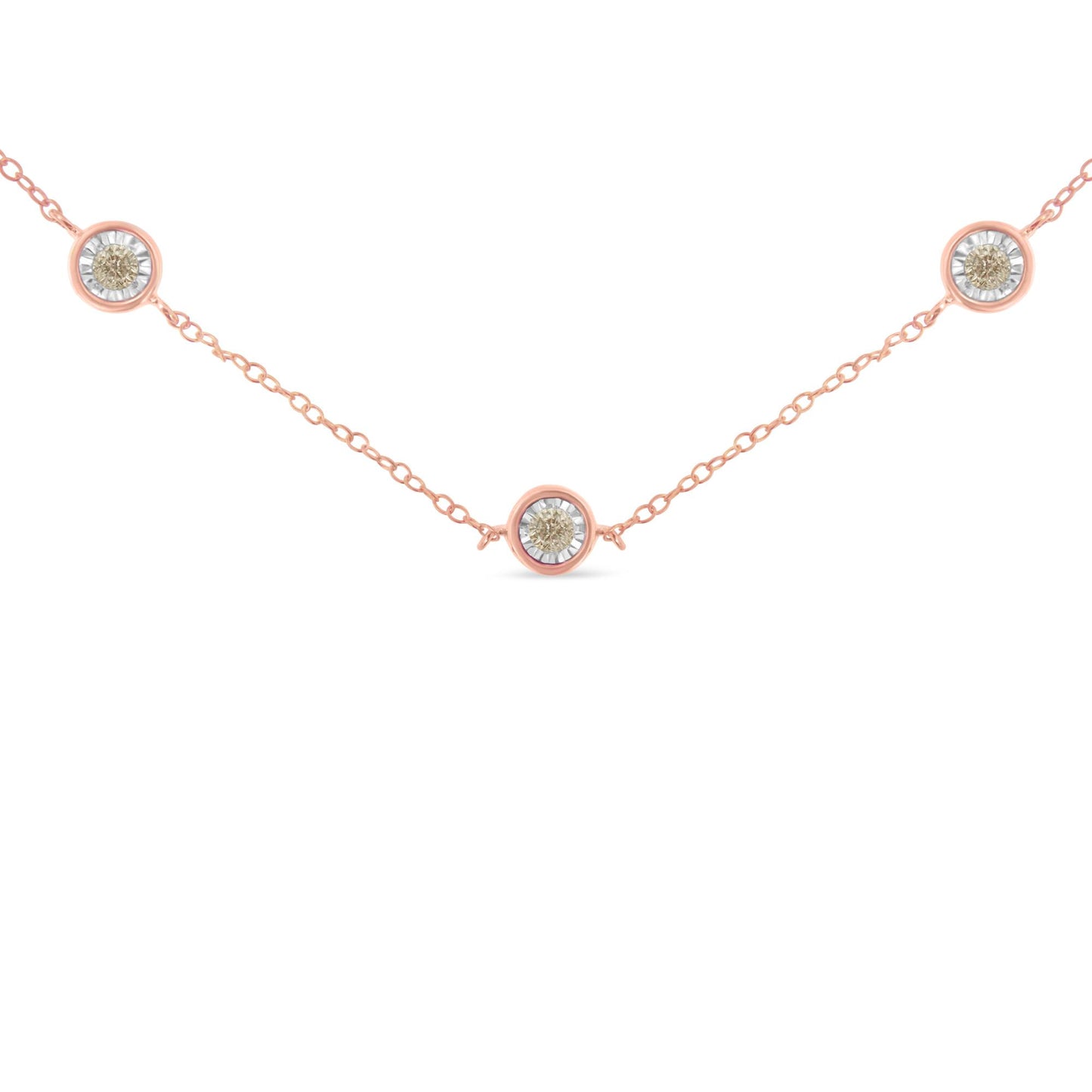 Rose metal necklace with three round brownish gemstones in miracle settings, shown from the front angle.