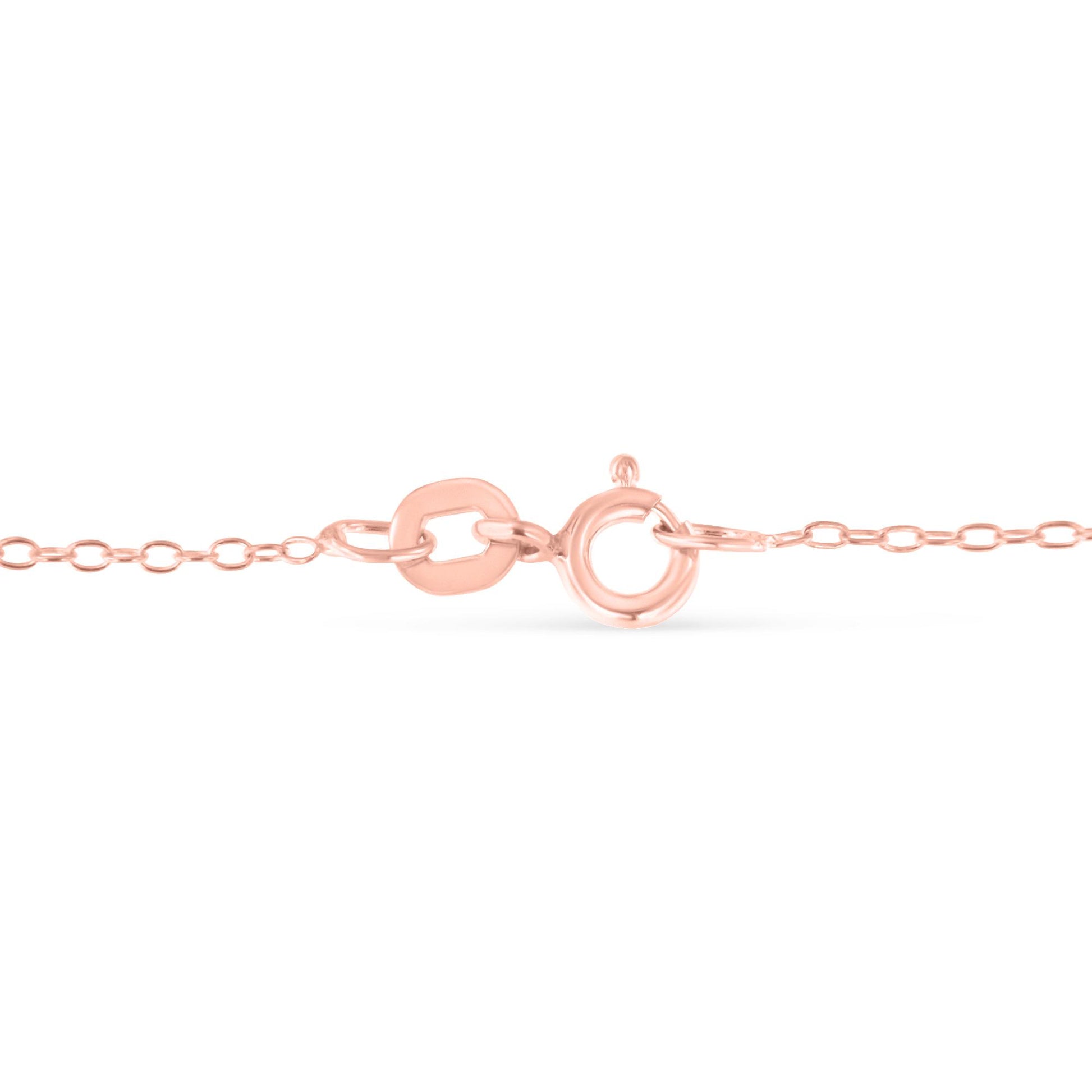 Close-up front angle of a rose-colored necklace chain with an oval clasp.