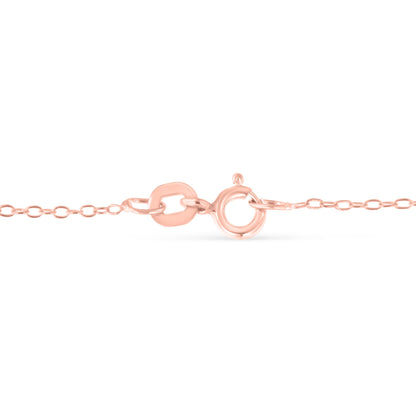 Close-up front angle of a rose-colored necklace chain with an oval clasp.