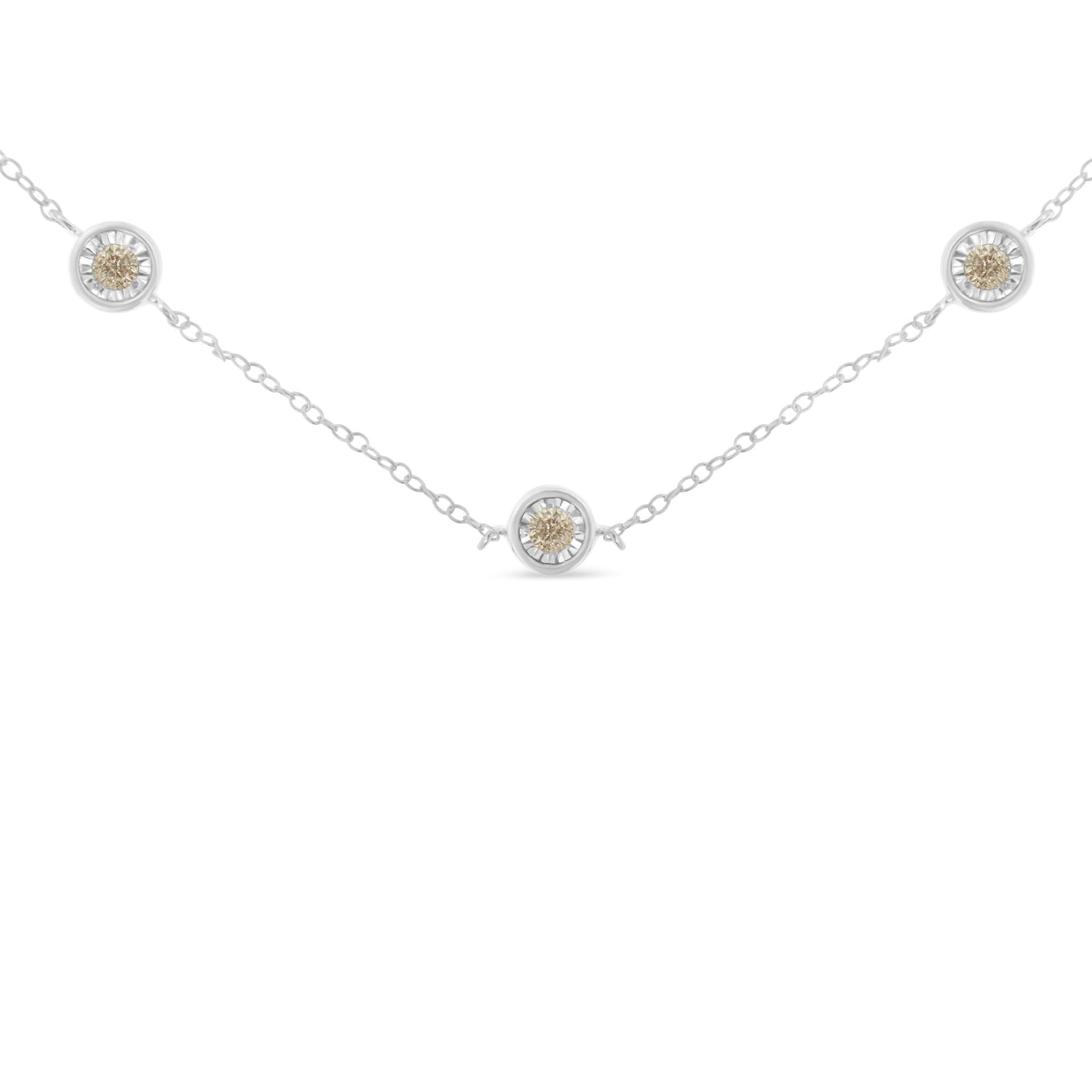 White metal necklace with round white gemstones in miracle settings, photographed from the front on a white background.