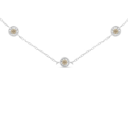 White metal necklace with round white gemstones in miracle settings, photographed from the front on a white background.