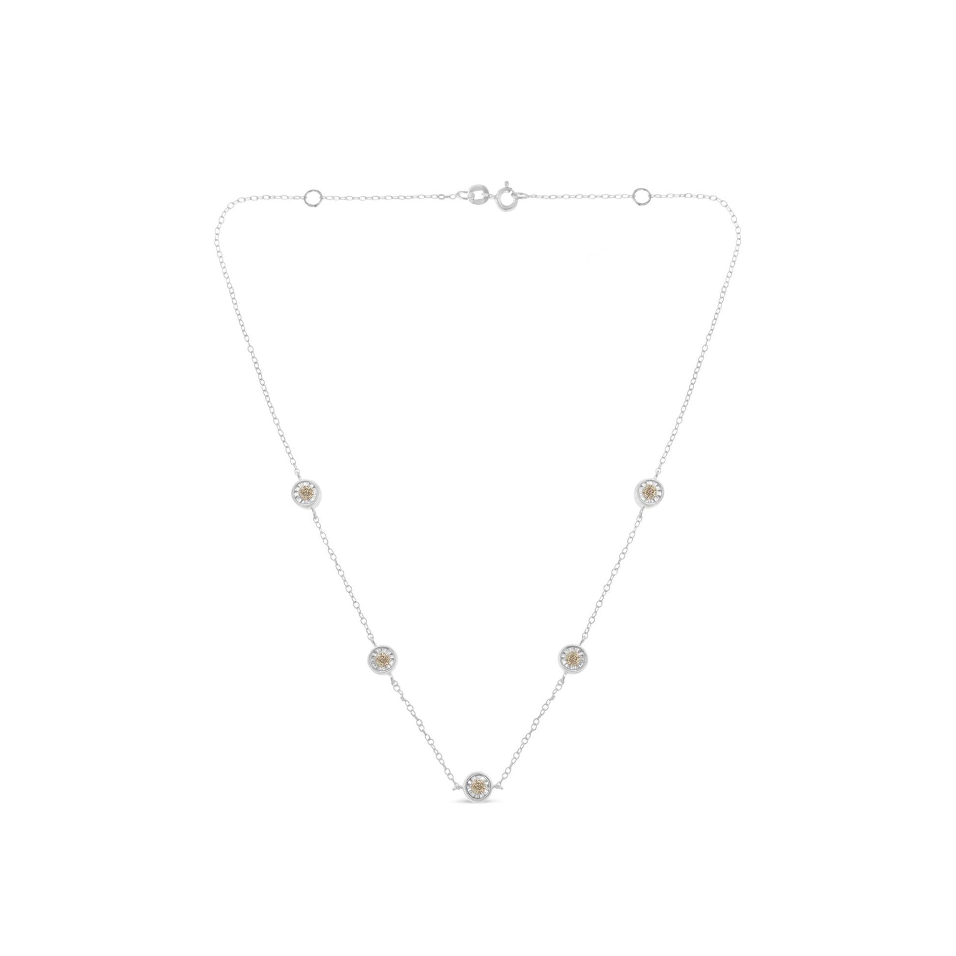 White metal necklace with five round white gemstones in bezel settings, front-facing angle.