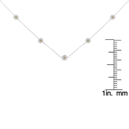 White metal necklace with five round white gemstones in miracle settings, displayed flat with a ruler for size reference.