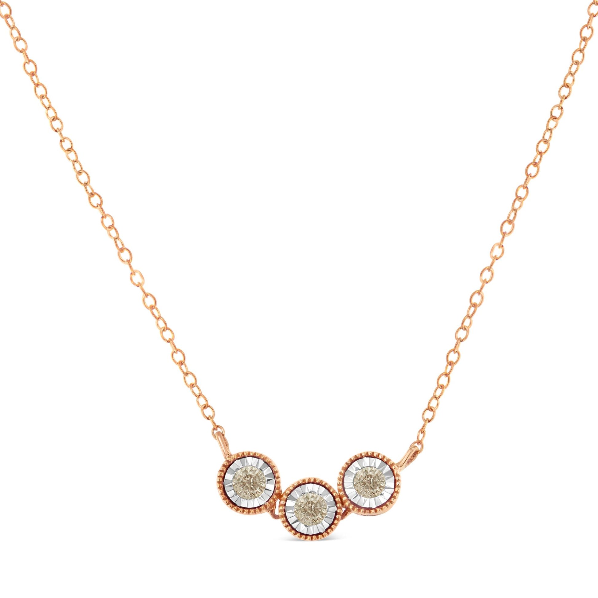 Front-facing shot of a two-toned necklace featuring three round-shaped champagne-colored gemstones in miracle settings.