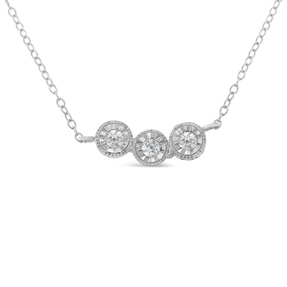 Front-facing view of a white metal necklace featuring three round white gemstones in miracle settings.