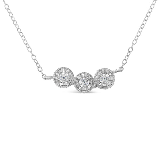 Front-facing view of a white metal necklace featuring three round white gemstones in miracle settings.