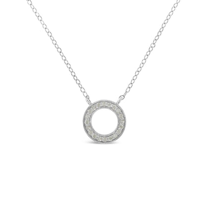 Front view of a white metal necklace with a circular pendant paved with round white gemstones.