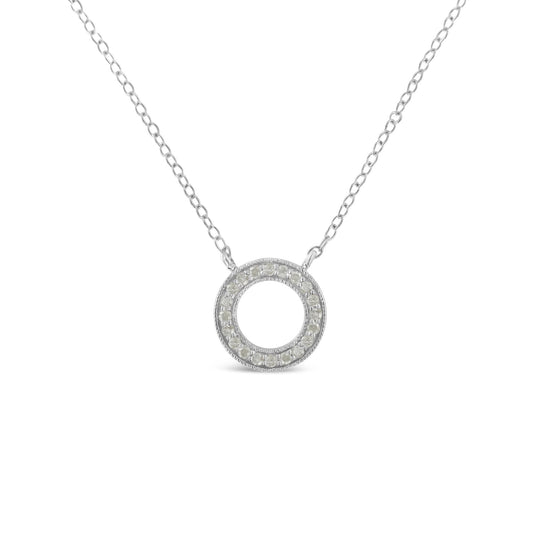 Front view of a white metal necklace with a circular pendant paved with round white gemstones.