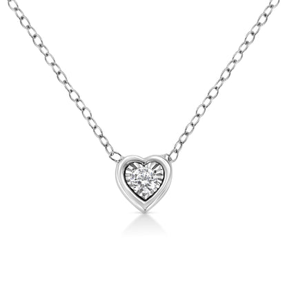 Close-up front view of a white metal heart-shaped necklace with a round white gemstone in a miracle setting at its center.