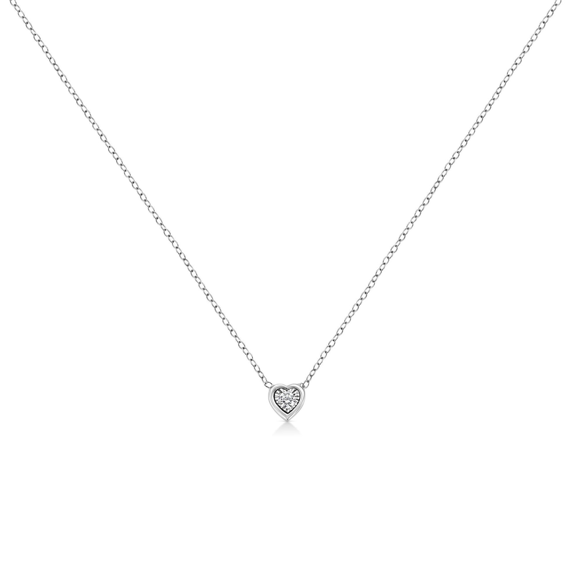 White metal necklace with a heart-shaped pendant featuring a round white gemstone, shown in a front-facing view.