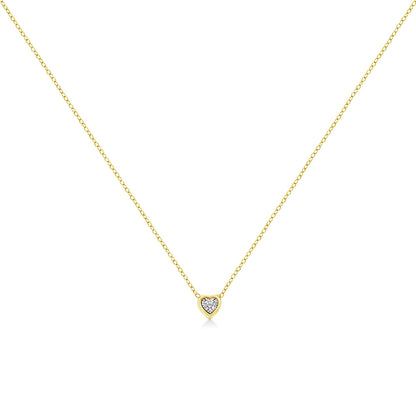 Front-facing shot of a yellow necklace with a heart-shaped pendant featuring a round white gemstone in miracle setting.