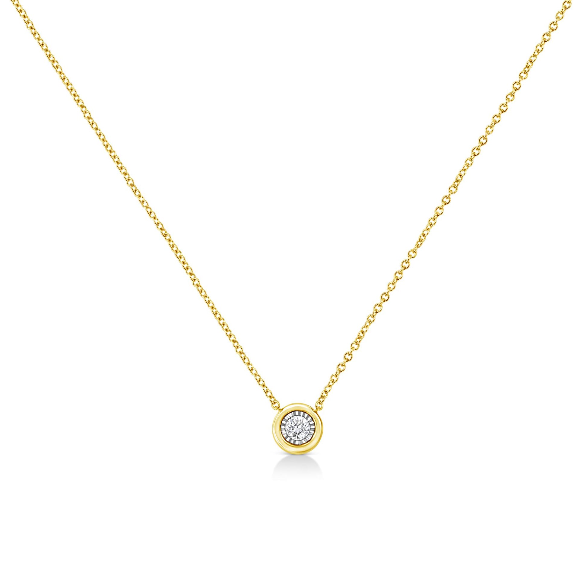 Front-facing view of a yellow metal necklace with a round shaped gemstone in a miracle setting pendant.