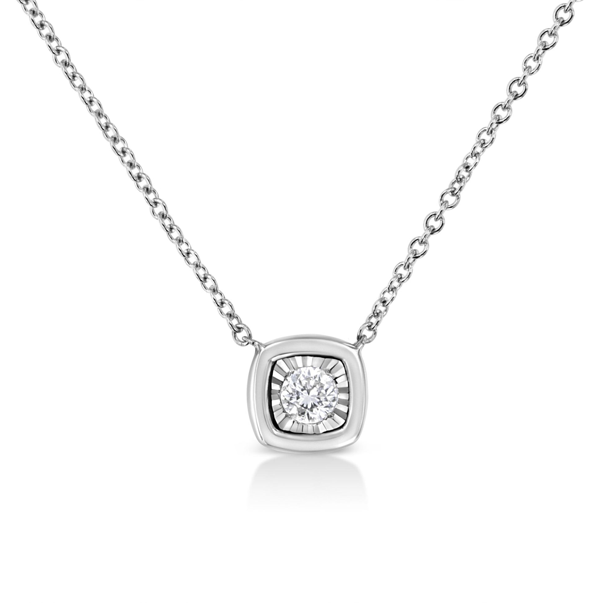 Front angle shot of a white necklace with a square pendant featuring a round white gemstone in miracle setting.
