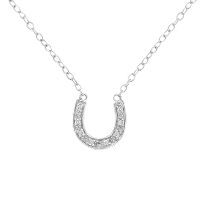 Front view of white metal horseshoe-shaped necklace pendant with round pave-set white gemstones on a chain.