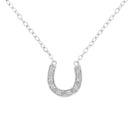 Front view of white metal horseshoe-shaped necklace pendant with round pave-set white gemstones on a chain.